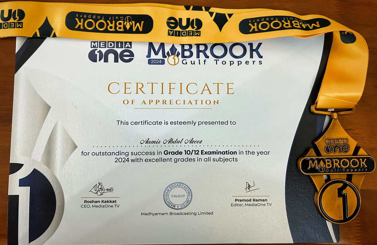 The MediaOne Mabrook Gulf Toppers 2024 Certificate of Appreciation and medal