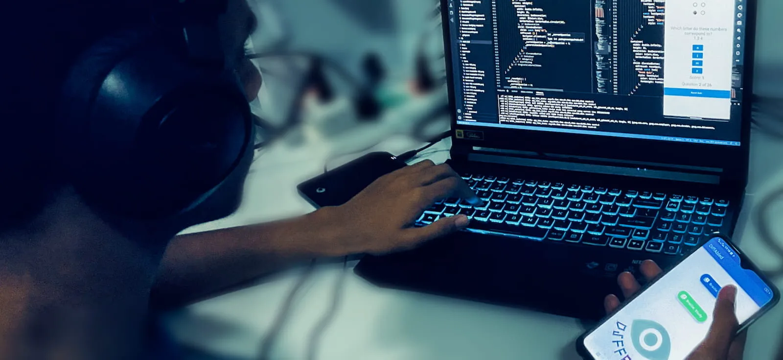 DiffAbled open on a phone, held beside its code on a laptop
